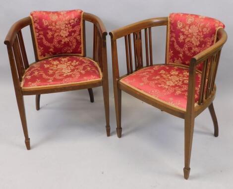 A pair of Edwardian mahogany and boxwood strung tub type chairs