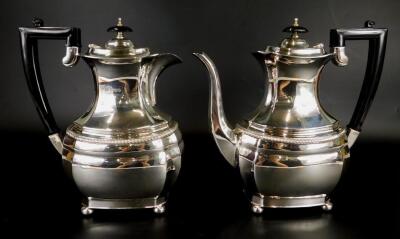 An Elizabeth II silver coffee pot and matching hot water jug