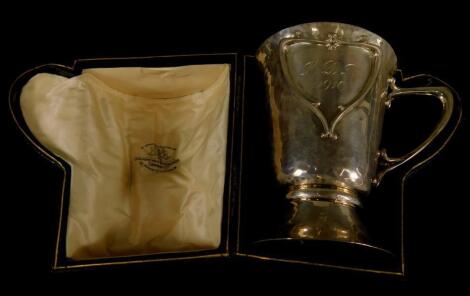 A silver mug or christening cup