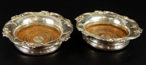 A pair of 19thC silver plated wine coasters