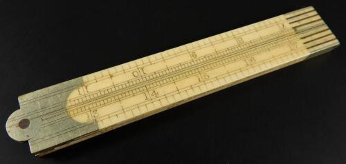 A late 19thC 24" four fold ivory and nickel scale rule