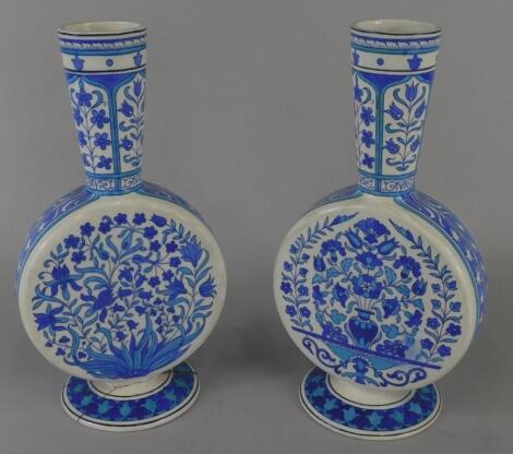 A pair of Minton Iznik style pottery moon flasks