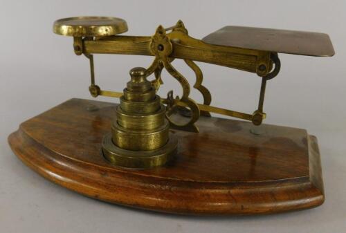 A set of late 19th/early 20thC walnut and brass letter scales