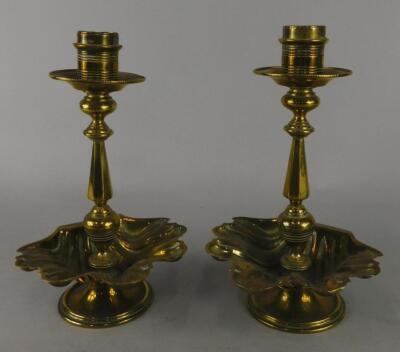 A pair of 19thC brass candlesticks