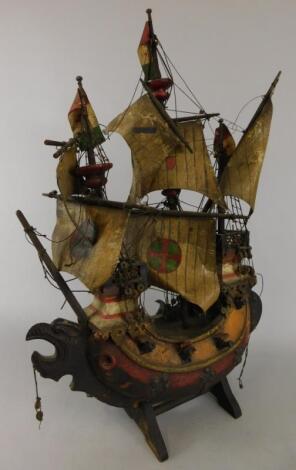 A carved and painted wooden three mast galleon