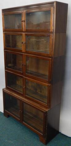 An early 20thC four section mahogany Globe Wernicke type bookcase