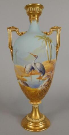 A Royal Worcester two handled ovoid vase