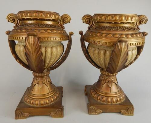 A pair of modern gilt vases