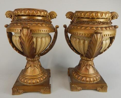 A pair of modern gilt vases