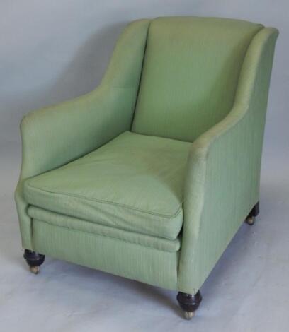 An Edwardian wingback armchair