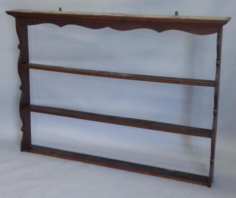 An early 19thC oak delft or plate rack