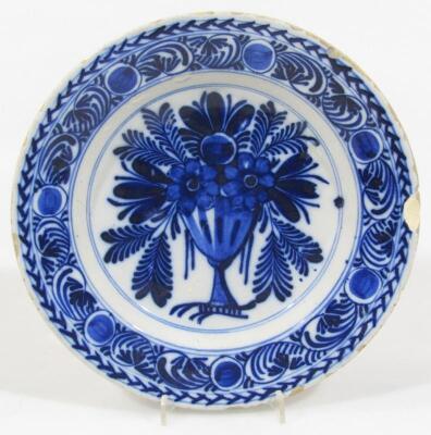 An 18thC blue and white tin glazed earthenware plate