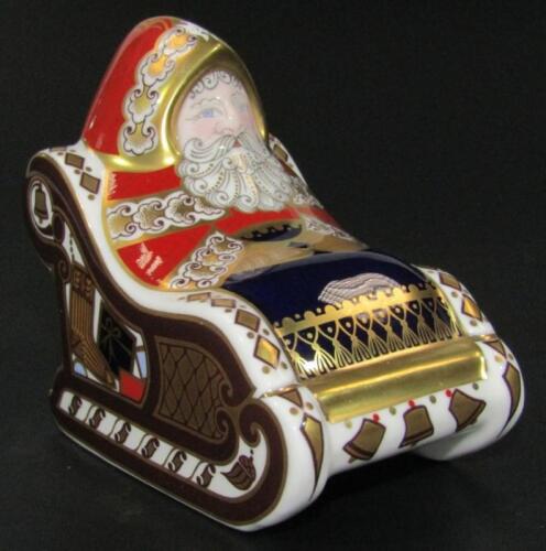 A Royal Crown Derby Santa Claus in a sleigh paperweight