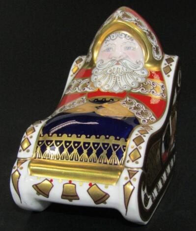 A Royal Crown Derby Santa Claus in a sleigh paperweight