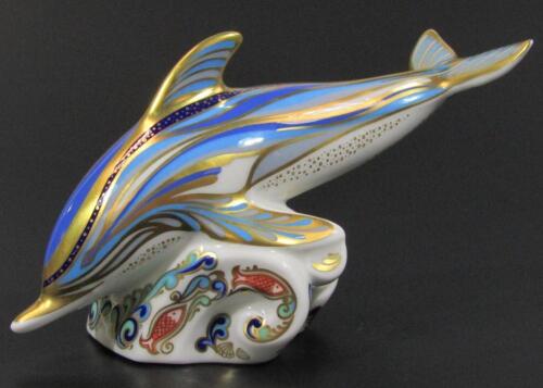 A Royal Crown Derby dolphin paperweight