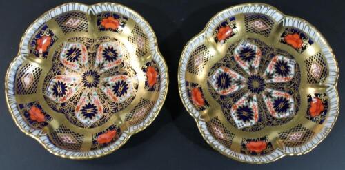 A matched pair of Royal Crown Derby Imari pattern pin dishes