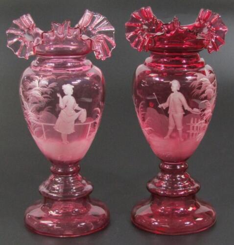 A Mary Gregory style cranberry glass vase