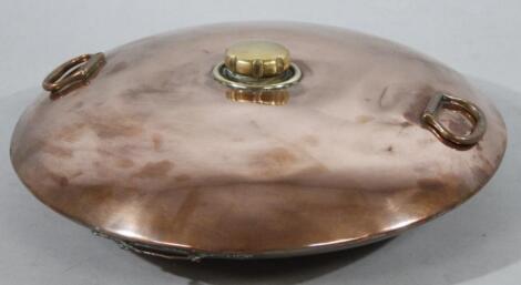 An early 20thC copper and brass warmer