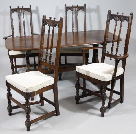 An Ercol dark wood dining table