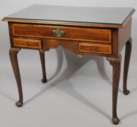 A George III and later walnut and mahogany framed low boy