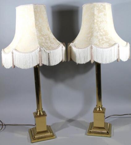 A pair of modern brass table lamps