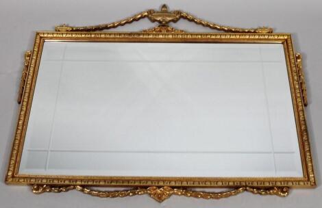 An oblong wall mirror