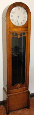 A 1930's oak longcase clock