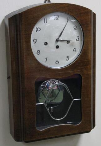 A mid 20thC polished wall clock