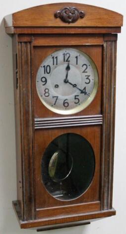 An early 20thC mahogany cased wall clock