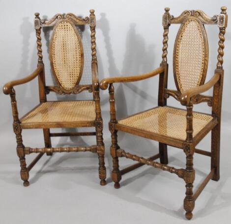 A pair of early 20thC Carolean oak bergere chairs