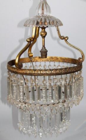 A moulded glass and gilt metal hanging chandelier