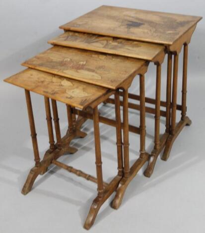 A nest of four early 20thC Gallé style marquetry tables