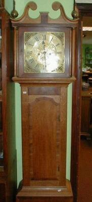 A 19thC oak cased longcase clock with brass dial inscribed B.Shaw