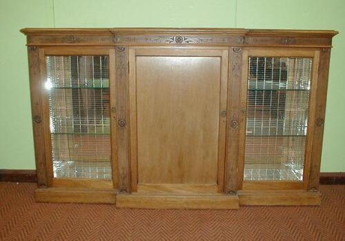 A Victorian walnut breakfront side cabinet with scratch carved decoration