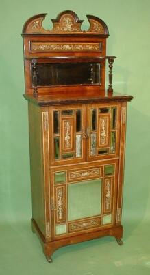 A fine Edwardian rosewood music cabinet with marquetry inlays and stringing