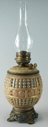 A late 19thC pottery oil lamp by Fischer of Budapest