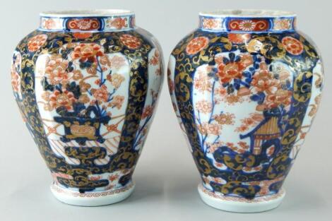 A pair of Japanese style Imari vases