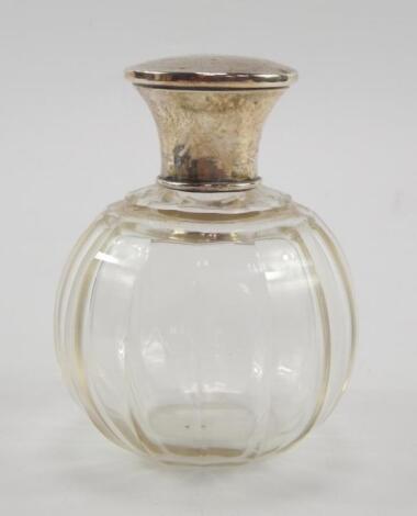 A George V cut glass scent bottle with a silver lid