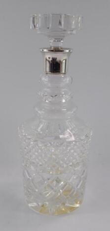 A cut glass decanter and stopper