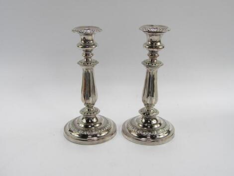 A pair of late 19thC silver plated candlesticks