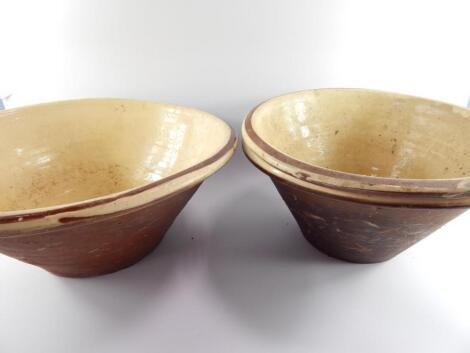 Three terracotta and white slipware dough bowls