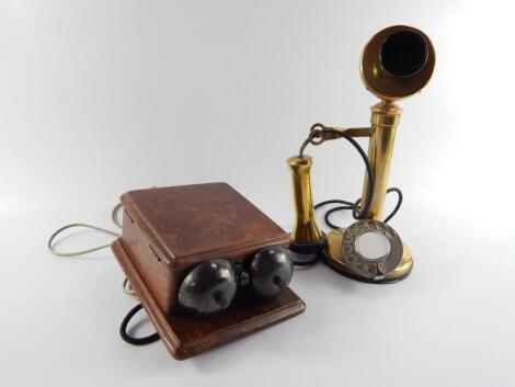 An early 20thC brass and bakelite candlestick telephone