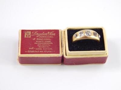 A diamond five stone gypsy ring