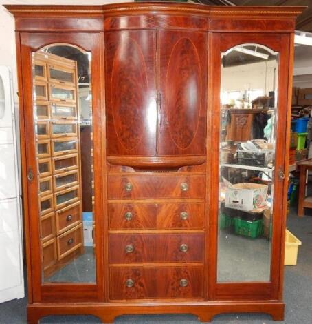 An Edwardian Maple & Co mahogany compactum wardrobe