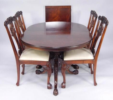 A Chippendale style twin pedestal mahogany dining table