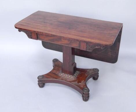 A Regency mahogany fold over tea table