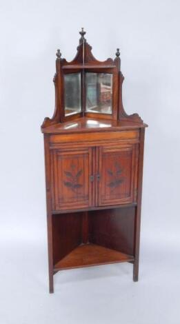 A Victorian mahogany corner cabinet