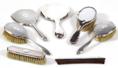 A matched silver dressing table set