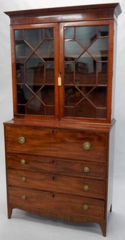 A Regency mahogany and ebony strung secretaire bookcase