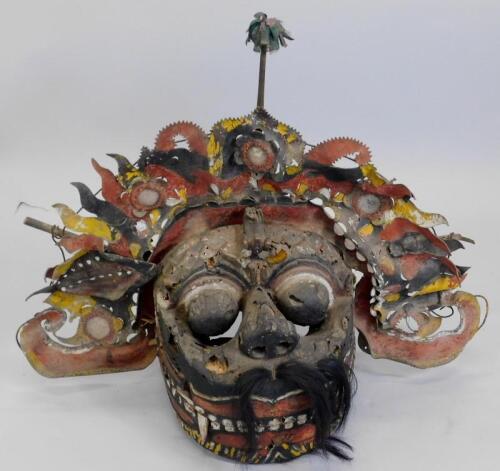 Tribal Art. An Eastern polychrome painted wood and leather dragon mask